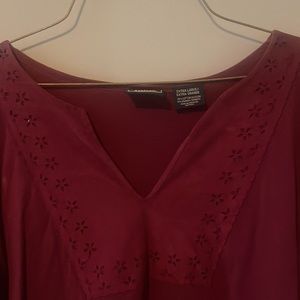 Maroon long sleeve shirt with flower design.
